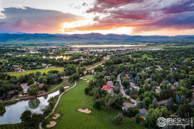 aerial view of a water and mountain view and a golf club