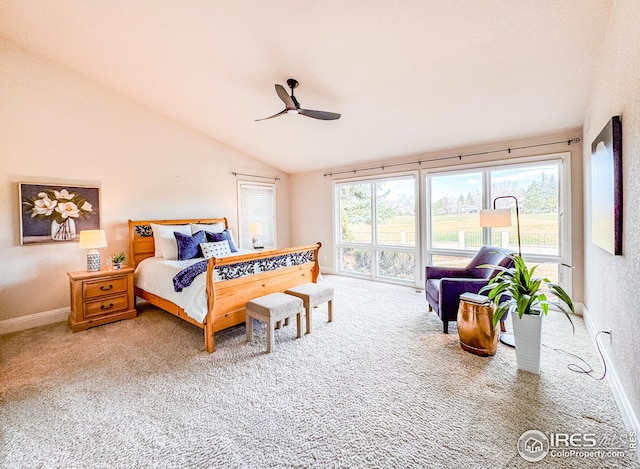 carpeted bedroom with lofted ceiling, baseboards, and a ceiling fan