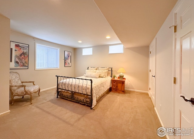 bedroom featuring light carpet, baseboards, and recessed lighting