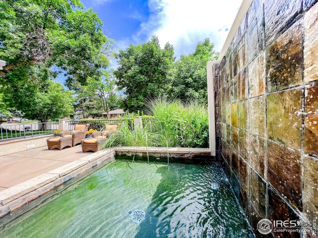 view of yard with fence and outdoor lounge area