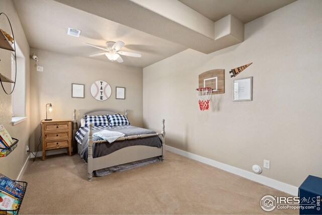 bedroom featuring baseboards, a ceiling fan, visible vents, and carpet floors