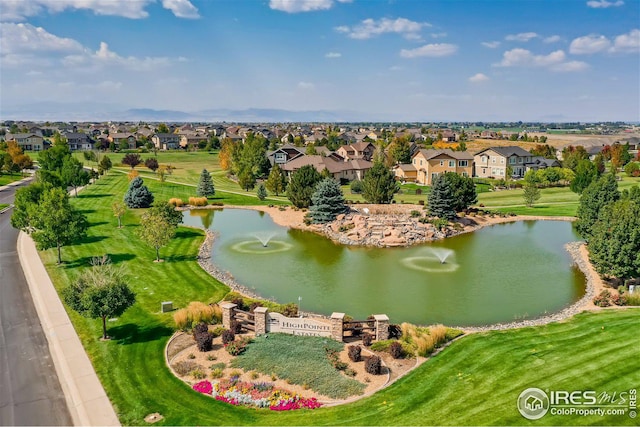 aerial view featuring a residential view and a water view