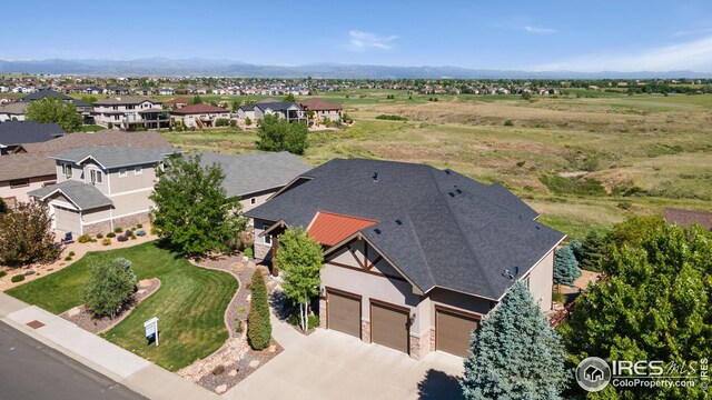 drone / aerial view with a residential view and a mountain view