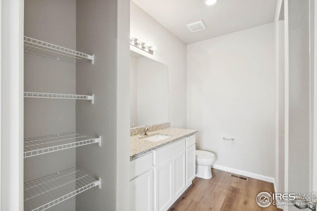 954 Cascade Falls St, Severance, CO 80550 - bathroom featuring vanity and wood finished floors