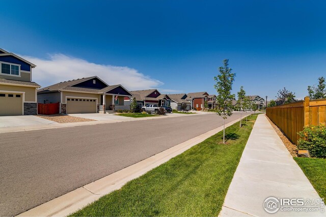 954 Cascade Falls St, Severance, CO 80550 - view of asphalt road with a residential view and sidewalks