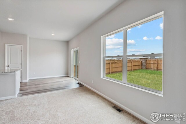 954 Cascade Falls St, Severance, CO 80550 - empty room with carpet floors, plenty of natural light, and recessed lighting