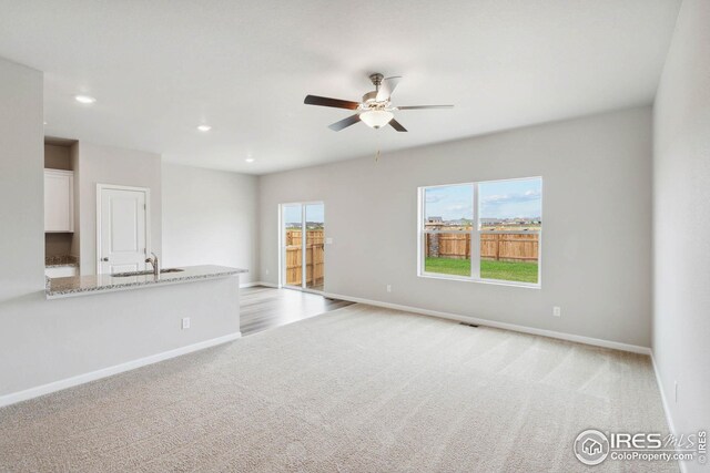 954 Cascade Falls St, Severance, CO 80550 - unfurnished room featuring light carpet, ceiling fan, and recessed lighting