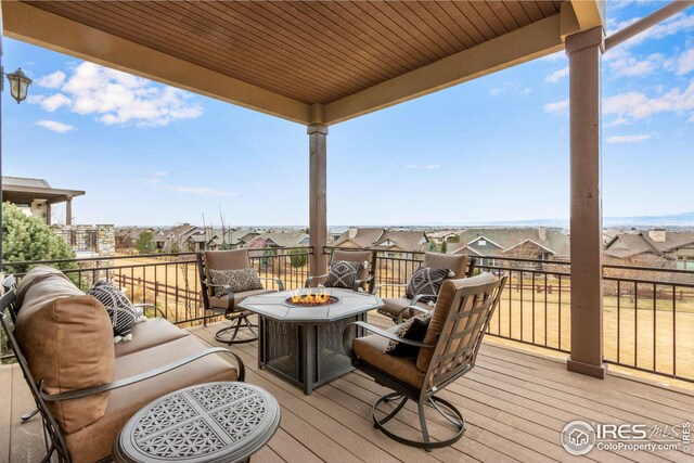 3865 Valley Crest Dr, Timnath, CO 80547 - deck featuring an outdoor fire pit and a residential view