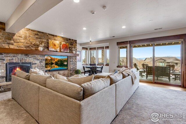 3865 Valley Crest Dr, Timnath, CO 80547 - living area featuring a fireplace, visible vents, recessed lighting, and light wood-type flooring
