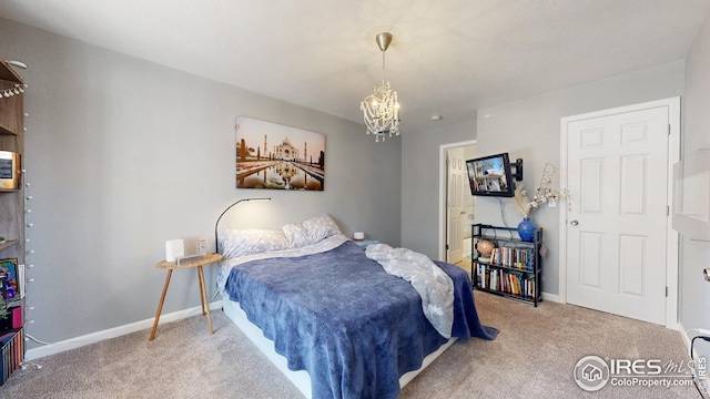 bedroom with carpet flooring, baseboards, and a chandelier