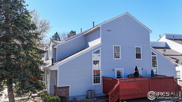 rear view of property with fence