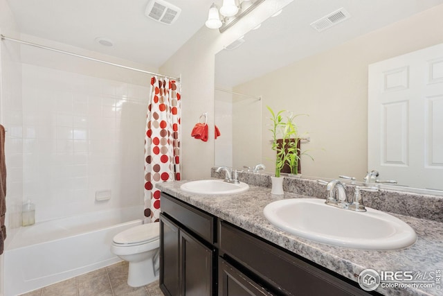 full bath featuring visible vents, toilet, a sink, and shower / bath combo with shower curtain