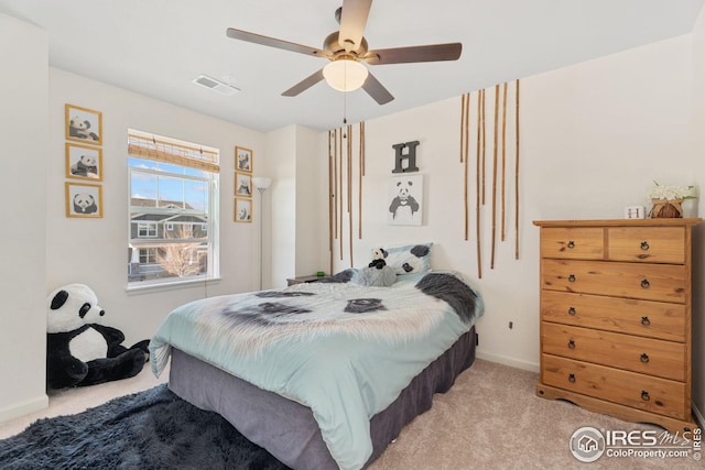 bedroom with ceiling fan, baseboards, light colored carpet, and visible vents