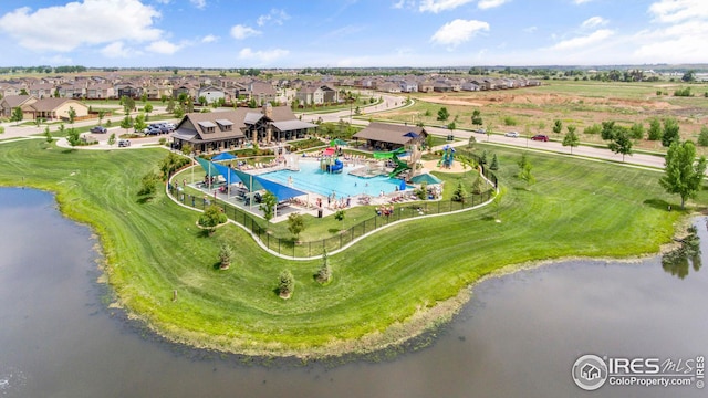 bird's eye view with a residential view and a water view