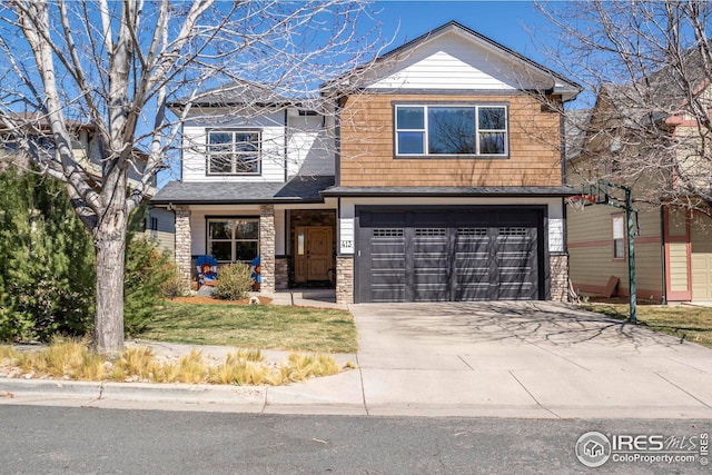 craftsman inspired home featuring a front yard, concrete driveway, and a garage