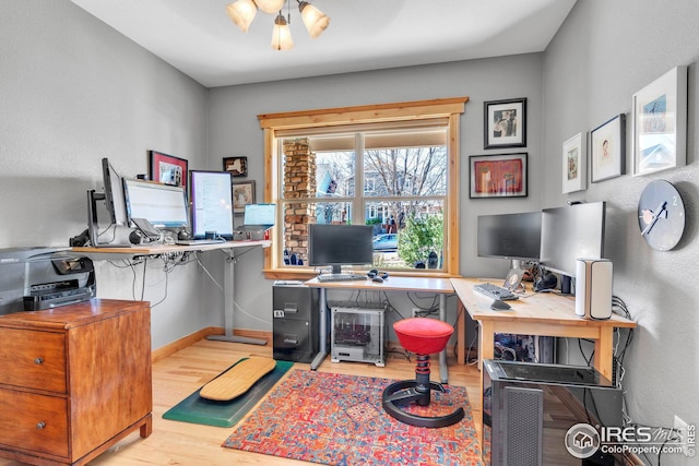 home office with wood finished floors and baseboards
