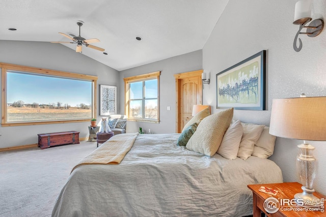 bedroom with carpet floors and vaulted ceiling