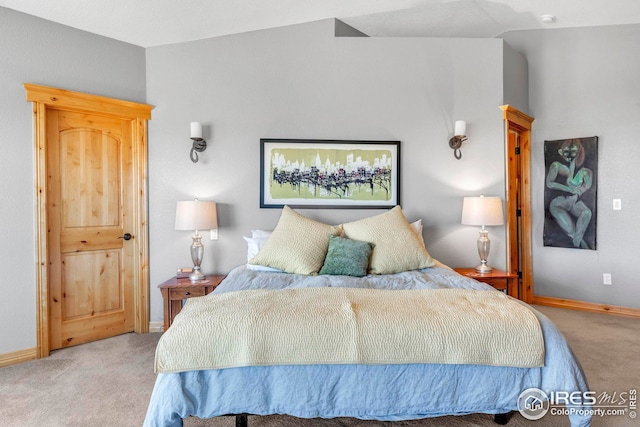 bedroom with carpet and baseboards