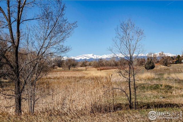 property view of mountains featuring a rural view