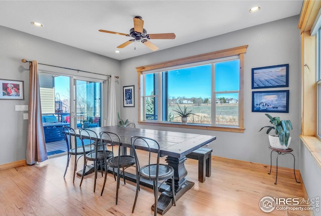 dining space with baseboards, recessed lighting, ceiling fan, and light wood-style flooring