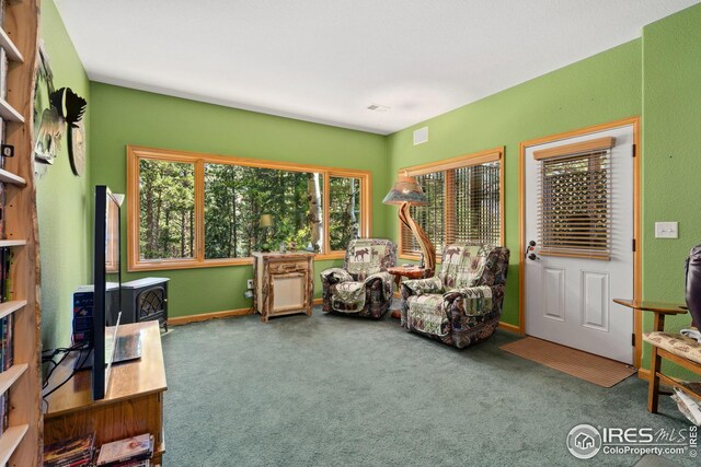 sitting room with carpet floors and visible vents