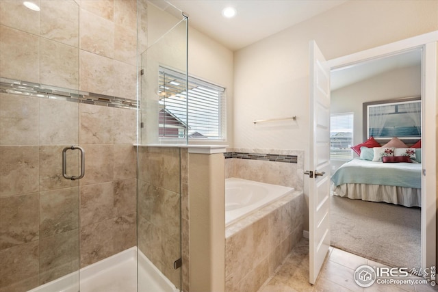 bathroom with connected bathroom, a shower stall, tile patterned flooring, a bath, and recessed lighting