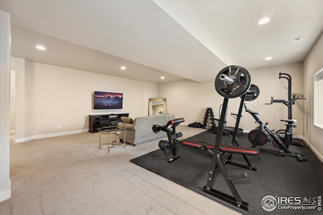 exercise area with carpet floors, baseboards, and recessed lighting