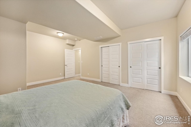 bedroom with carpet flooring and baseboards