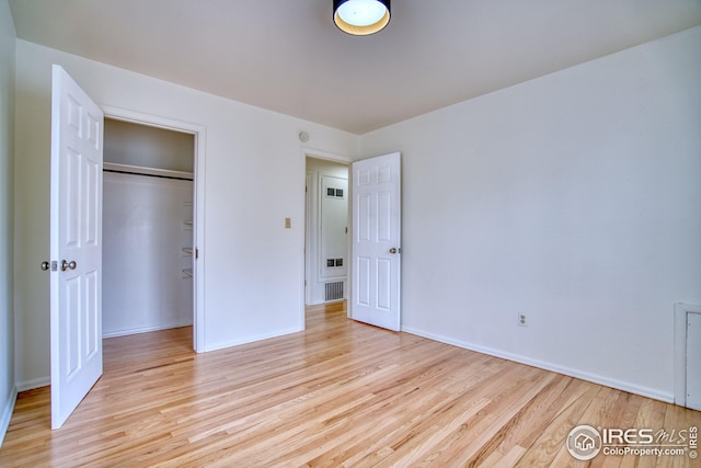325 27th St, Boulder, CO 80305 - unfurnished bedroom with a closet and light wood-style flooring