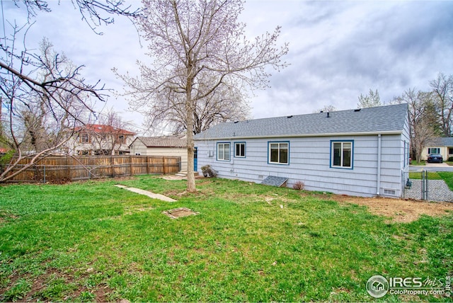 325 27th St, Boulder, CO 80305 - rear view of property with fence, crawl space, a gate, a shingled roof, and a yard
