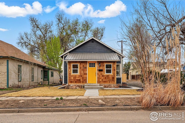 219 N Washington Ave, Loveland, CO 80537 - bungalow-style home featuring metal roof