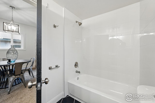 219 N Washington Ave, Loveland, CO 80537 - full bathroom featuring baseboards, toilet, and shower / washtub combination