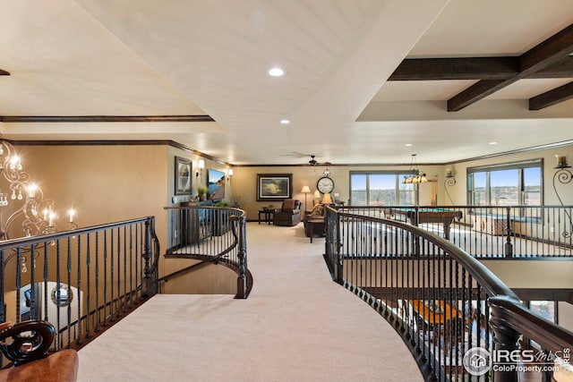 hallway featuring an upstairs landing, recessed lighting, a chandelier, carpet floors, and beamed ceiling