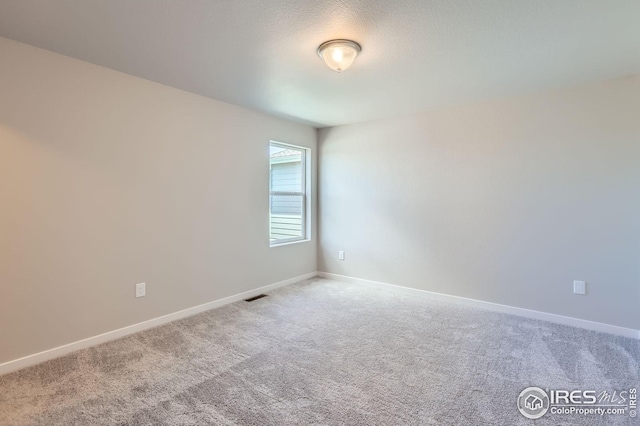 786 Griffith St, Lochbuie, CO 80603 - unfurnished room with carpet floors and baseboards