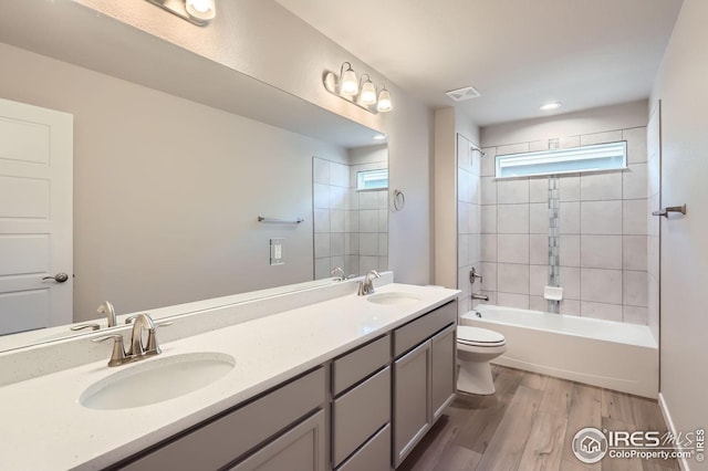 786 Griffith St, Lochbuie, CO 80603 - bathroom featuring toilet, healthy amount of natural light, double vanity, and  shower combination