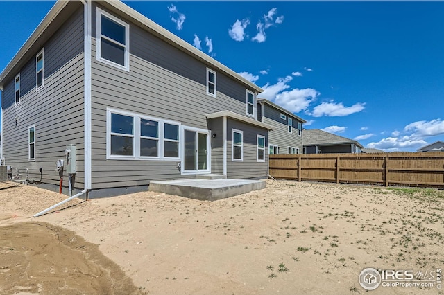 786 Griffith St, Lochbuie, CO 80603 - rear view of property with a fenced backyard and a patio area