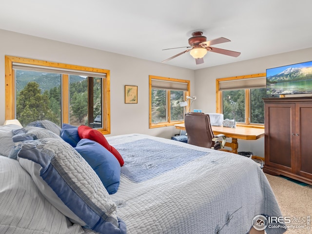 carpeted bedroom featuring a ceiling fan