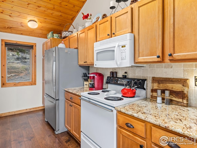 kitchen with dark wood-type flooring, decorative backsplash, baseboards, and white appliances