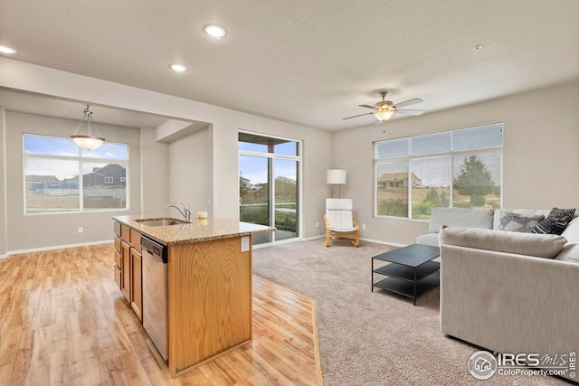 living room featuring baseboards, a textured ceiling, recessed lighting, and a ceiling fan