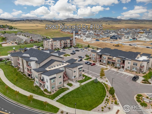 bird's eye view with a residential view and a mountain view