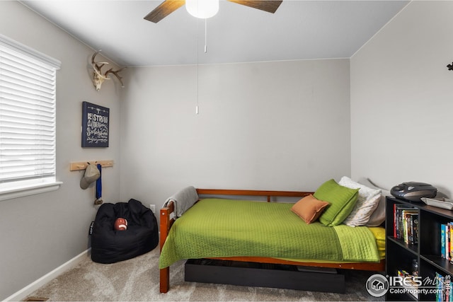 bedroom with carpet, ceiling fan, and baseboards