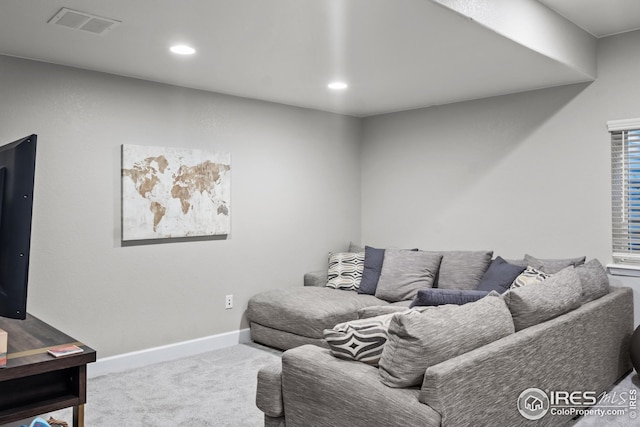 carpeted living room with baseboards and recessed lighting