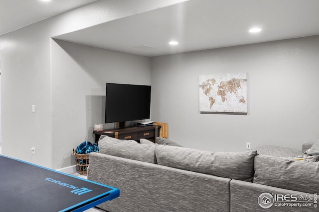 living room featuring recessed lighting and baseboards