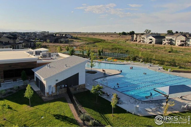 aerial view of residential area featuring a pool