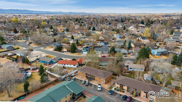 birds eye view of property with a mountain view and a residential view
