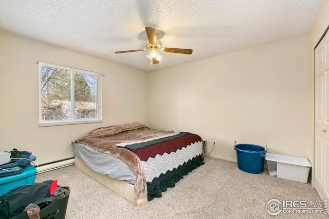 carpeted bedroom with a textured ceiling, ceiling fan, and a baseboard radiator