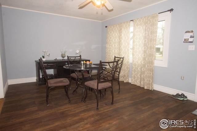 dining room featuring a ceiling fan, ornamental molding, baseboards, and wood finished floors