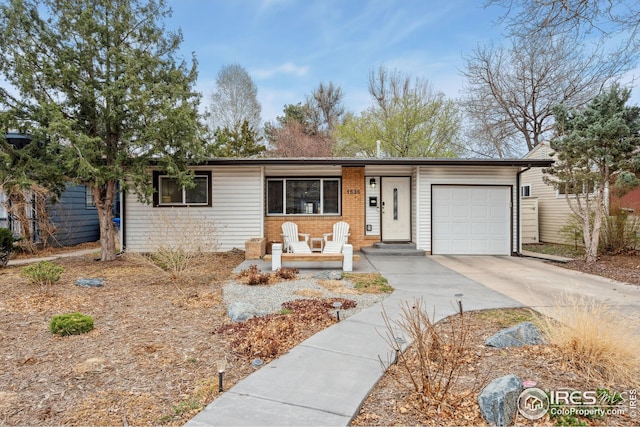 single story home with an attached garage and driveway