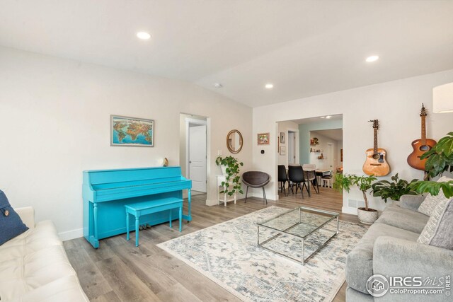 dining area featuring light wood-type flooring and baseboards