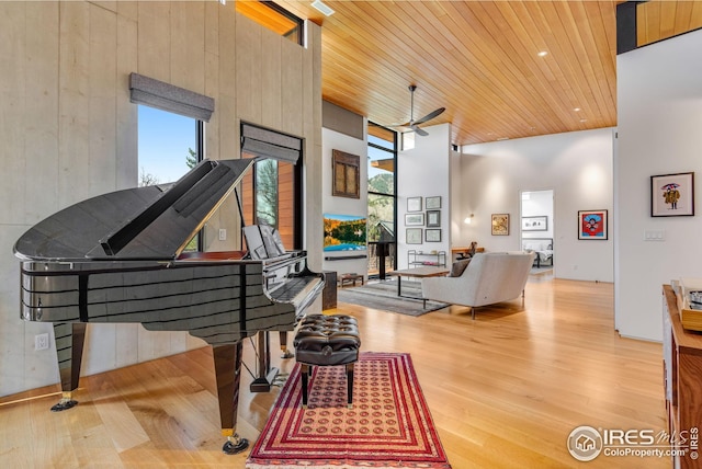 interior space featuring ceiling fan, wood ceiling, and wood finished floors